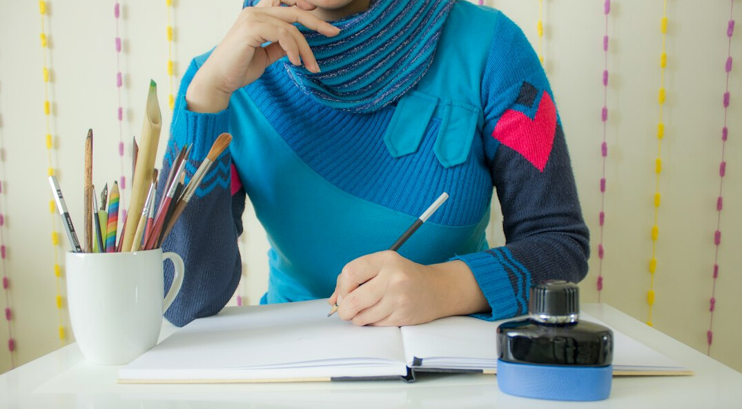 writer at desk writing