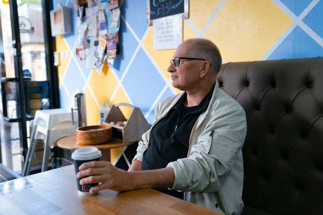 author sitting in cafe