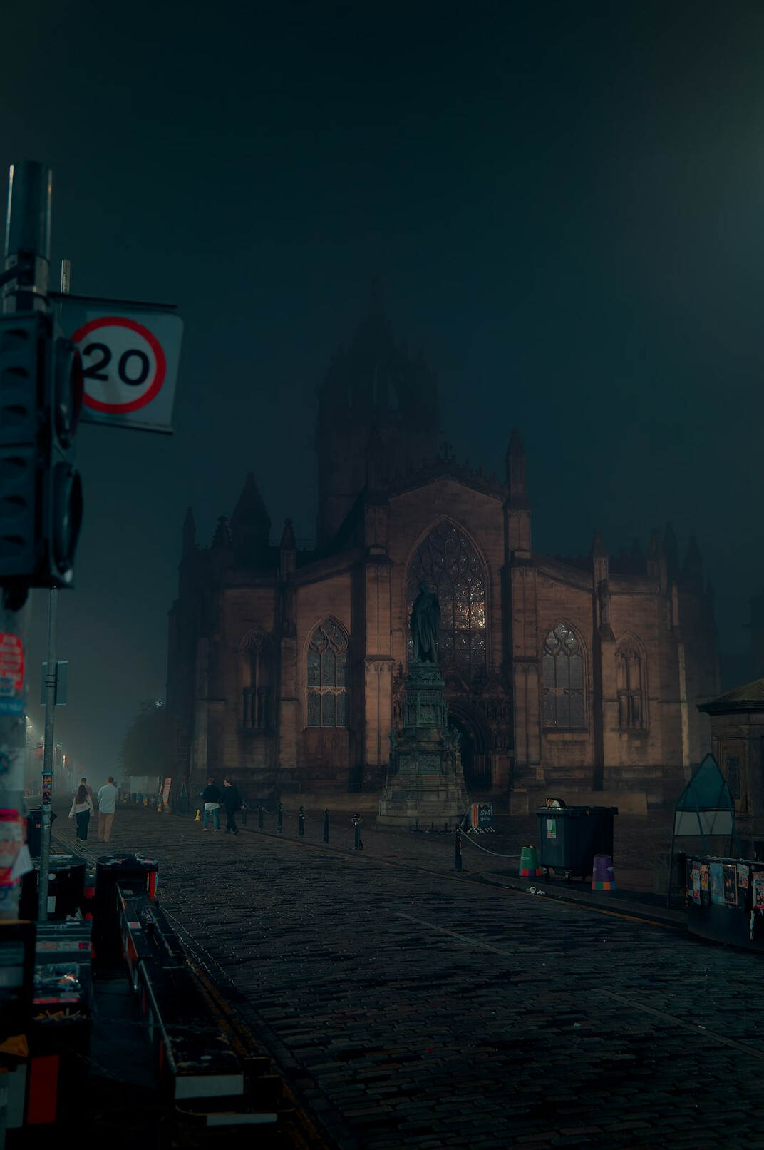 person walking in foggy street