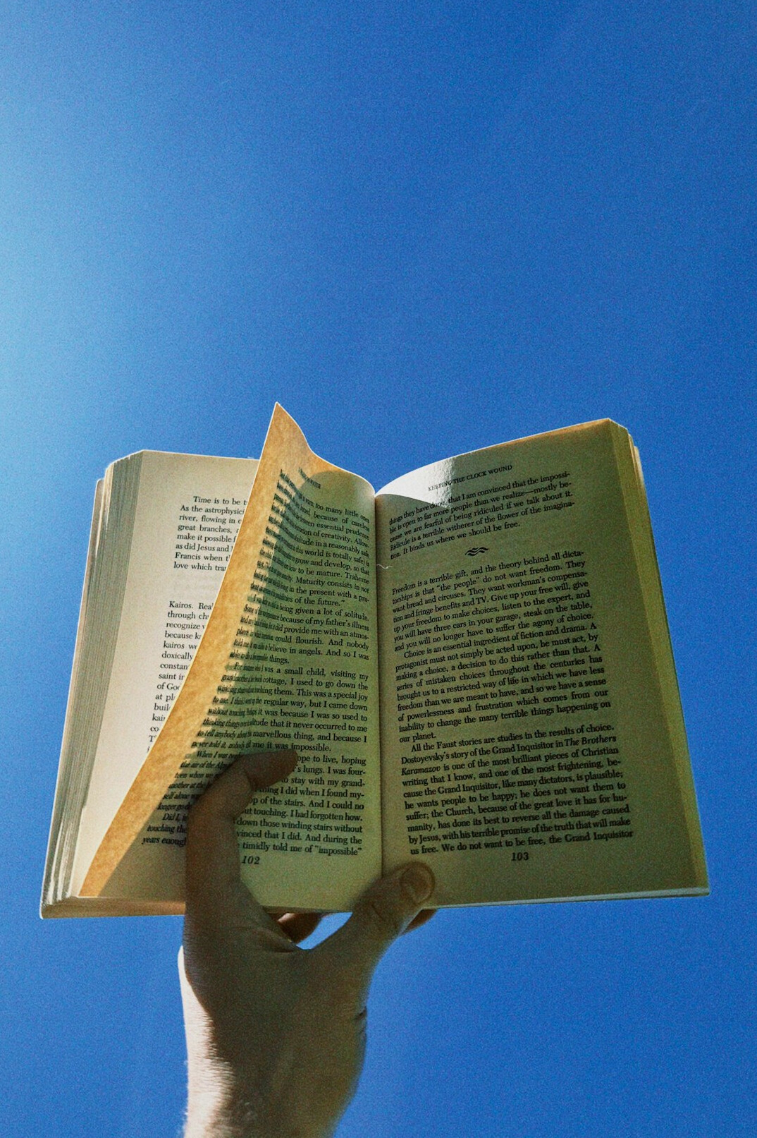hand turning book page